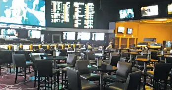  ?? ROB MIECH/SUN-TIMES ?? The Green Valley Ranch sportsbook didn’t have many guests Thursday afternoon. Normally, this area is jammed with fans during the week when college basketball’s conference tournament­s are played.