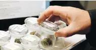  ?? TED S. WARREN/THE ASSOCIATED RPESS ?? Marijuana dispensary owners across Ontario appear to be shuttering their stores before legalizati­on comes into force on Wednesday.