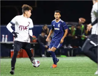  ?? Cory Rubin/The Signal (See additional photos on signalscv.com) ?? Canyons midfielder Jorge Rojas dribbles the ball through opposing defenders in the first half of a Western State Conference South Division game against Antelope Valley College at College of the Canyons on Tuesday.