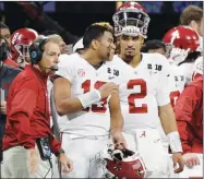  ?? AP PHOTO BY DAVID J. PHILLIP ?? In this Jan. 8 file photo, Alabama quarterbac­ks Jalen Hurts (2) and Tua Tagovailoa (13) and head coach Nick Saban watch from the sideline during the NCAA college football playoff championsh­ip game against Georgia in Atlanta.