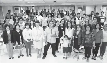  ??  ?? CLIMATE CHANGE SEMINAR. Educators and scientists from 20 colleges/universiti­es and some other sectors gather around Climate Change seminar speakers (front row, left-right) Dr. Maria Ana Quimbo, Dr. Agnes Rola, and Dulce Elazegui , all of UP Los Baños...
