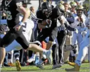  ?? KIRK NEIDERMYER - FOR DFM ?? Berks Catholic’s Luis Garcia tries to slide by Bishop McDevitt’s Aaron Gethers during the PIAA District III AAAA Football Championsh­ip at Hersheypar­k Stadium in Hershey on Friday, November 24, 2017.