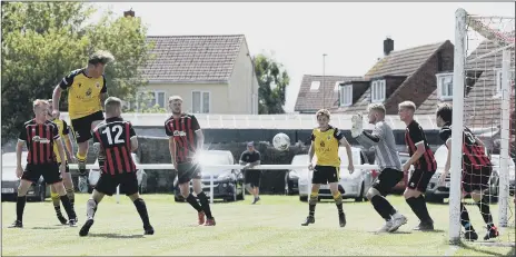  ??  ?? HEADS WE WIN Baffins’ Jamie White (yellow, left) rises to score with a header in the friendly win at Fleetlands