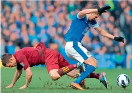  ?? — AFP ?? Everton’s Kevin Mirallas (right) is tackled by Manchester City’s James Milner during their English Premier League match at the Goodison Park Stadium in Liverpool on Saturday. Everton won 2-0.