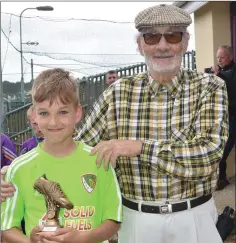  ??  ?? Filip Wasilewski of Legia receives the award for the top goalscorer from sponsor Seánie Fenlon.