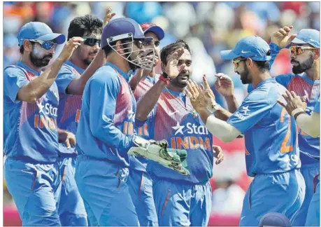  ?? PTI PHOTO ?? Leg-spinner Amit Mishra (3/24) provided a vital breakthrou­gh by dismissing Johnson Charles (43). R Ashwin then combined with pacer Jasprit Bumrah to tighten the noose around West Indies batsmen with regular strikes.