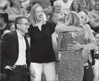  ?? SEAN D. ELLIOT/THE DAY ?? In this July 19, 2019, file photo, Connecticu­t Sun guard Jasmine Thomas gives Atlanta Dream head coach Nicki Collen a hug as Sun coaches Curt Miller, left, and Brandi Poole look-on before the Sun play the Dream in WNBA game at Mohegan Sun Arena.