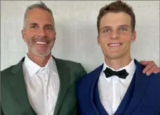  ?? Courtesy Tracy Grady ?? Michael Grady, right, poses with his father, John, who holds the Concept2 indoor rowing world record of 1:21.7 in the 500 meters in the men’s 60-69 category.