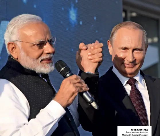  ?? MIKHAIL SVETLOV/ GETTY IMAGES ?? GIVE AND TAKE Prime Minister Narendra Modi with Russian President Vladimir Putin during their May 21 summit in Sochi, Russia