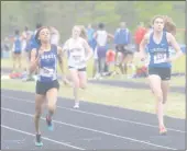  ?? STAFF PHOTO BY TED BLACK ?? Lackey High School’s Destiny Thompson, center, pulls away from Leonardtow­n’s Renee Nosko, right, to prevail in the girls 400-meter run on Wednesday afternoon at McDonough High School in Pomfret.