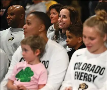  ?? HELEN H. RICHARDSON — THE DENVER POST ?? CU women’s basketball coach JR Payne, center in second row, with her husband Toriano Towns, left, and son Jaxton, 8, waits with her players as they watch and hear which seed they will be in the NCAA tournament during a watch party in the Touchdown Club at Dal Ward at the University of Colorado in Boulder on Sunday.