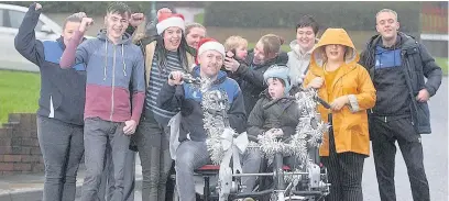  ?? Colin J. Horne ?? Jason Hencher and his bike with family and friends from Globe Bullough Park FC
