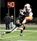  ?? Photo by Kevin Sutton ?? ■ Texas High wide receiver Rian Cellers goes airborne to pull in a pass under heavy defense by a West Mesquite player Friday in Mesquite, Texas.