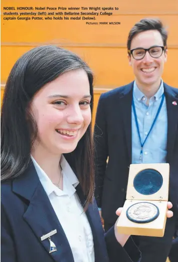  ?? Pictures: MARK WILSON ?? NOBEL HONOUR: Nobel Peace Prize winner Tim Wright speaks to students yesterday (left) and with Bellarine Secondary College captain Georgia Potter, who holds his medal (below). .