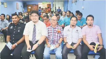  ??  ?? (From second left) Dr Chieng and Joseph among the many at Kapit Hospital’s open day on Saturday.