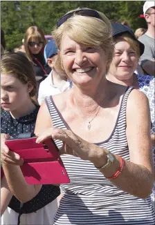  ??  ?? Bridie Lowe gets ready to capture a photo during the visit of Taoiseach Leo Varadkar to officially open the Neighbourw­oods Paths at Roundwood Reservoirs.