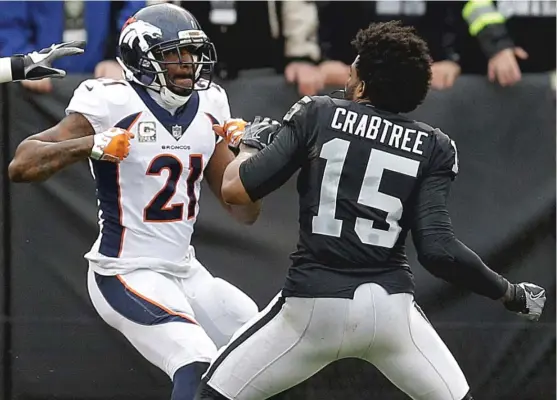  ?? | BEN MARGOT/ AP ?? Broncos cornerback Aqib Talib and Raiders wide receiver Michael Crabtree square off after Crabtree aggressive­ly blocked Talib on a running play. Bothwere ejected.