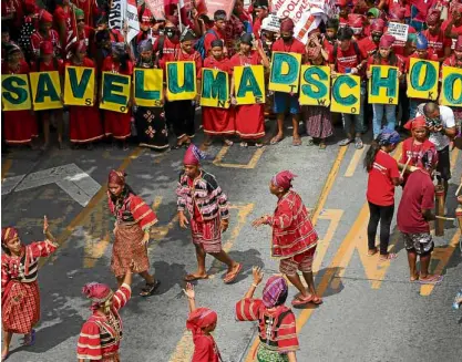  ?? —EDWIN BACASMAS ?? “Lumad” tribesmen perform a protest dance during President Duterte’s State of the Nation Address on Monday.