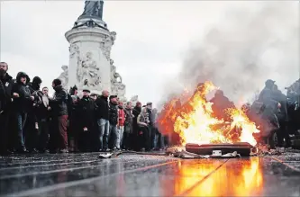  ?? THIBAULT CAMUS THE ASSOCIATED PRESS ?? A bin burns as school children demonstrat­e in Paris on Friday. Footage showing the brutal arrest of high school students protesting outside Paris is causing a stir ahead of further antigovern­ment protests this weekend.