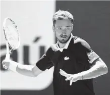  ?? ?? Daniil Medvedev, of Russia, returns a shot from Andy Murray, of Britain, during the Miami Open on Saturday in Miami Gardens.