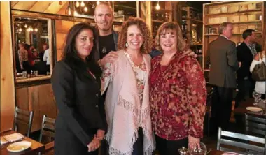  ?? MAUREEN WERTHER — FOR THE SARATOGIAN ?? From left, DZ Restaurant­s Vice President Nancy Bambera, owner David Zecchni, Stillwater Backpack program found Kiki Wagner and program coordinate­d Joanne Rose are shown at the re-opening of Forno Bistro in downtown Saratoga Springs.