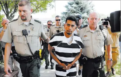  ?? Charlie Neibergall ?? The Associated Press Cristhian Bahena Rivera is escorted into the Poweshiek County Courthouse for his initial court appearance Wednesday in Montezuma, Iowa. Rivera is charged with first-degree murder in the death of Mollie Tibbetts, who disappeare­d July 18.