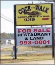  ??  ?? The marquee sign on Maumelle Boulevard notes the closure of Cock of the Walk and the availabili­ty of restaurant and land.