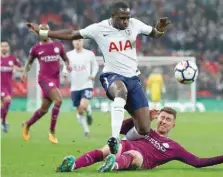  ??  ?? Tottenham’s Moussa Sissoko in action with Manchester City’s Aymeric Laporte. — Reuters