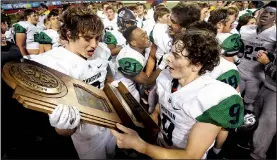  ?? Arkansas Democrat-Gazette/THOMAS METTHE ?? Little Rock Christian players embrace the championsh­ip trophy.