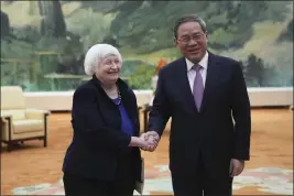  ?? TATAN SYUFLANA — THE ASSOCIATED PRESS ?? U.S. Treasury Secretary Janet Yellen meets Chinese Premier Li Qiang at the Great Hall of the People in Beijing, China, on Sunday.