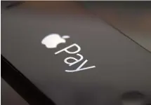  ?? Getty Images ?? Apple Pay’s logo on an iPhone