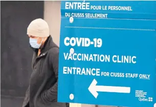  ?? RYAN REMIORZ THE CANADIAN PRESS ?? Provinces are being advised to delay administer­ing second injections of the COVID vaccine by up to three weeks while the country awaits a sharp increase in supplies, expected in April.