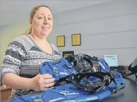  ?? KEVIN ADSHADE/THE NEWS ?? Robin Meyer of Trenton’s recreation department is shown with a pair of snowshoes available for loan.