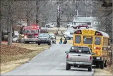  ?? RYAN HERMENS / THE PADUCAH SUN ?? Emergency crews respond to Marshall County High School after a fatal shooting Tuesday at the school in Benton, Ky. The 15-yearold suspect is in custody and will be charged with murder.