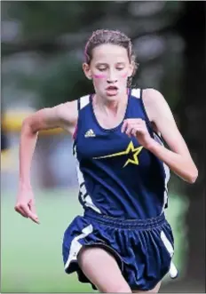  ??  ?? Nottingham’s Grace Dwyer runs to victory in the girls cross country meet held Tuesday at Veterans Park.