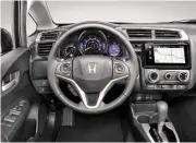  ??  ?? Honda’s LaneWatch system, standard on EX and above trims, is a neat camera system for displaying the driver’s blind spot.