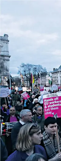  ??  ?? Protesters in support of the amendment to guarantee the legal status of EU citizens gathered outside the Houses of Parliament as the debate took place. Theresa May had feared a Conservati­ve rebellion but in the event only 11 MPs abstained