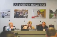  ?? STAFF PHOTO BY OLIVIA ROSS ?? Larry Grohn, Rhonda Thurman and Gary Kuehn sit at a Hamilton County school board meeting Oct. 20.