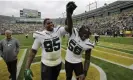  ?? Photograph: Mike Roemer/AP ?? Quinnen (left) and Quincy Williams walk off the field after helping the New York Jets to an impressive win over the Green Bay Packers.