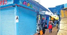  ??  ?? A shop marked with ‘A’ remains closed as per rotational system in Udhagamand­alam