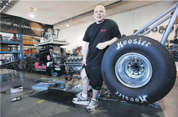  ?? NICK PROCAYLO/PNG FILES ?? Shawn Cowie, a local drag-racing driver who, in 2011, was nearly killed in a motorcycle crash in Tennessee, stands with his drag race car in Burnaby. Cowie currently leads the NHRA national points chase race.