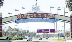  ?? JOHN RAOUX/THE ASSOCIATED PRESS ?? Cars travel one of the roads leading to Walt Disney World in Lake Buena Vista, Fla. Orlando’s top tourist destinatio­ns, Walt Disney World, Universal Orlando, SeaWorld and several resorts are in legal battles about how much they’re worth with the local...