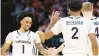  ?? GETTY RYAN M. KELLY/ ?? Virginia guard Dante Harris, left, celebrates with teammates Andrew Rohde, back right, and Reece Beekman during Wednesday night’s game against Virginia Tech in Charlottes­ville.