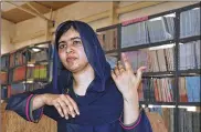  ?? JOSSY OLA / AP ?? Nobel Peace laureate Malala Yousafzai visits a school in Maiduguri, Nigeria, in July. The 20-year-old education activist will study philosophy, politics and economics at the prestigiou­s Oxford University.