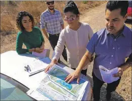  ??  ?? CONSULTANT­S Lucy Barraza, left, Sam Ward and Wendy Katagi meet with landscape designer Matt Romero on plans for the 7-acre city property.