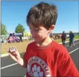  ??  ?? French Creek Elementary School fifth-grade student, Tyler Freire, checks his pedometer.