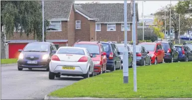  ??  ?? Parking problems in Loudon Way, Ashford, at the junction with Cypress Avenue