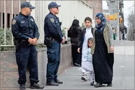  ?? / aP-Mark lennihan ?? Worshipper­s arrive for service at the Islamic Cultural Center of New York under increased police security following the shooting in New Zealand on Friday.