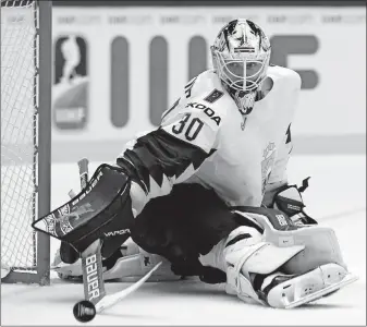  ?? [ASSOCIATED PRESS FILE PHOTO] ?? Elvis Merzlikins makes a save for Latvia against the U.S. during the world championsh­ips in 2018. The 24-year-old, who played the past five years in Switzerlan­d, hopes to get his U.S. work visa in time to arrive this week in Columbus.