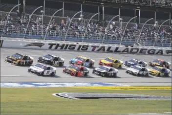  ?? ASSOCIATED PRESS ?? DENNY HAMLIN (11) AND KURT BUSCH (1) lead the field to the start of the YellaWood 500 NASCAR race at Talladega Superspeed­way on Sunday in Talladega, Ala.